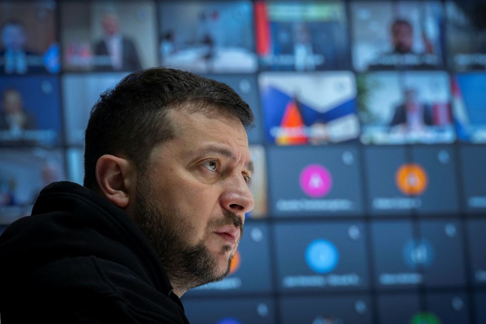 Ukraine's President Volodymyr Zelenskiy attends an online meeting with sport ministers of 35 countries to discuss a ban of Russian and Belarusian athletes from the 2024 Olympics, amid Russia's attack on Ukraine, in Kyiv, Ukraine February 10, 2023.  Ukrainian Presidential Press Service/Handout via REUTERS ATTENTION EDITORS - THIS IMAGE HAS BEEN SUPPLIED BY A THIRD PARTY.