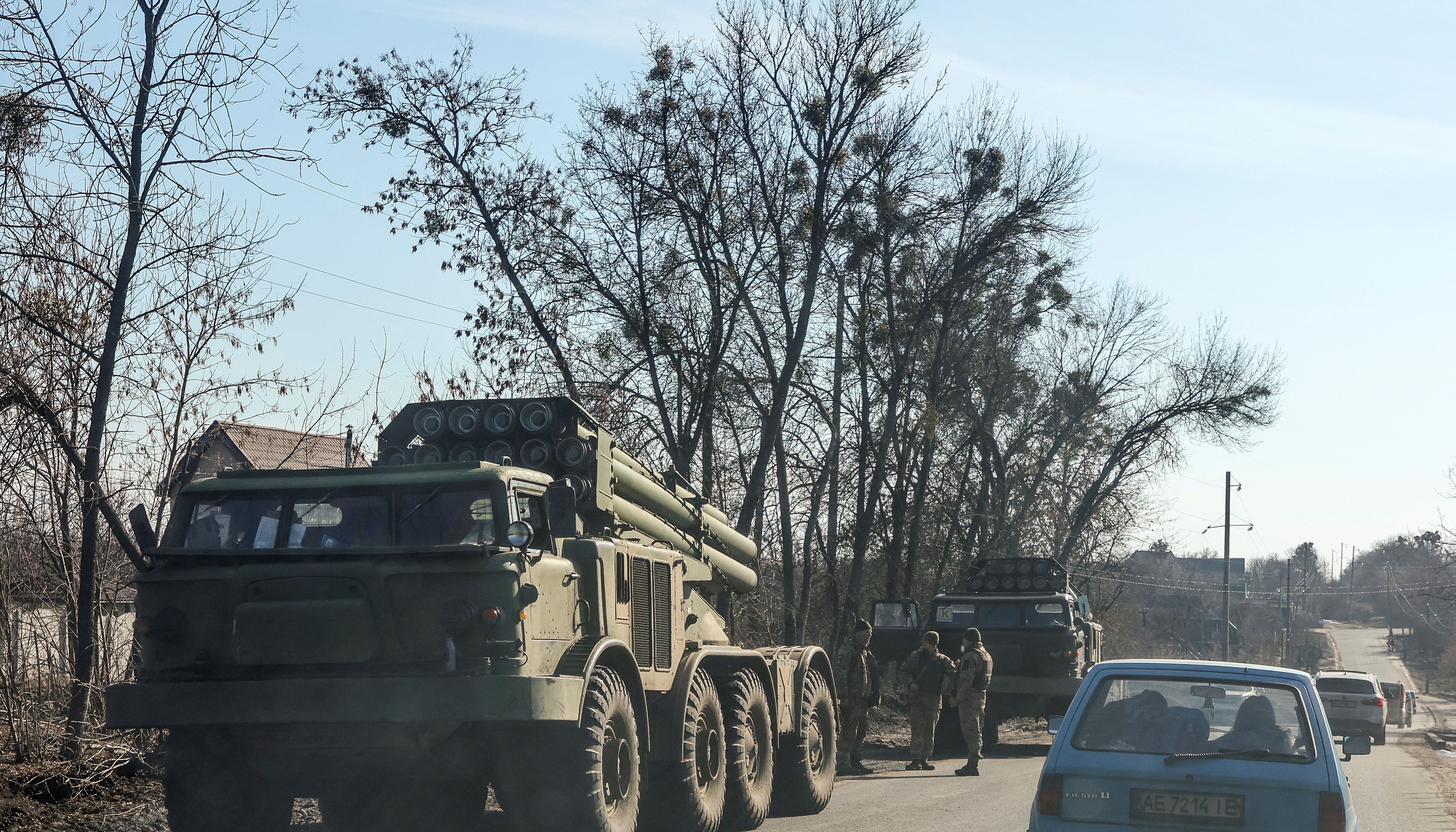 Ukrainian army soldier are seen next to multiple launch missile systems, after Russian President Vladimir Putin authorised a military operation, in eastern Ukraine, in Kharkiv region, Ukraine February 24, 2022. REUTERS/Antonio Bronic