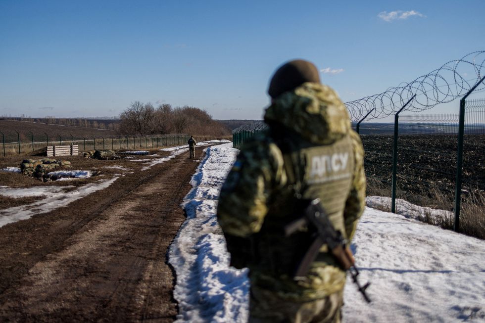 Ukrainian frontier guards patrol an area along the Ukrainian-Russian border in the Kharkiv region, Ukraine February 23, 2022. REUTERS/Antonio Bronic