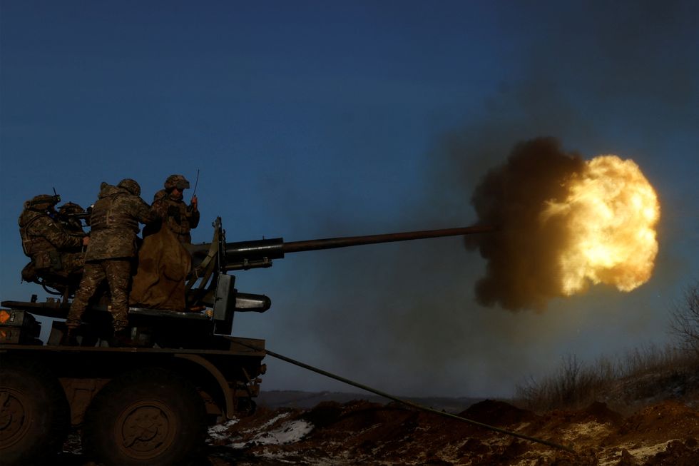 Ukrainian members of the military fire an anti-aircraft weapon, as Russia's attack on Ukraine continues, in the frontline city of Bakhmut, Ukraine, January 10, 2023. REUTERS/Clodagh Kilcoyne TPX IMAGES OF THE DAY
