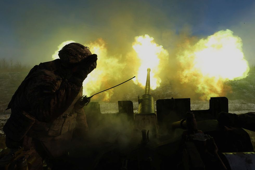 Ukrainian military fire an anti-aircraft weapon as defence chiefs predict a huge Russian attack on Ukraine