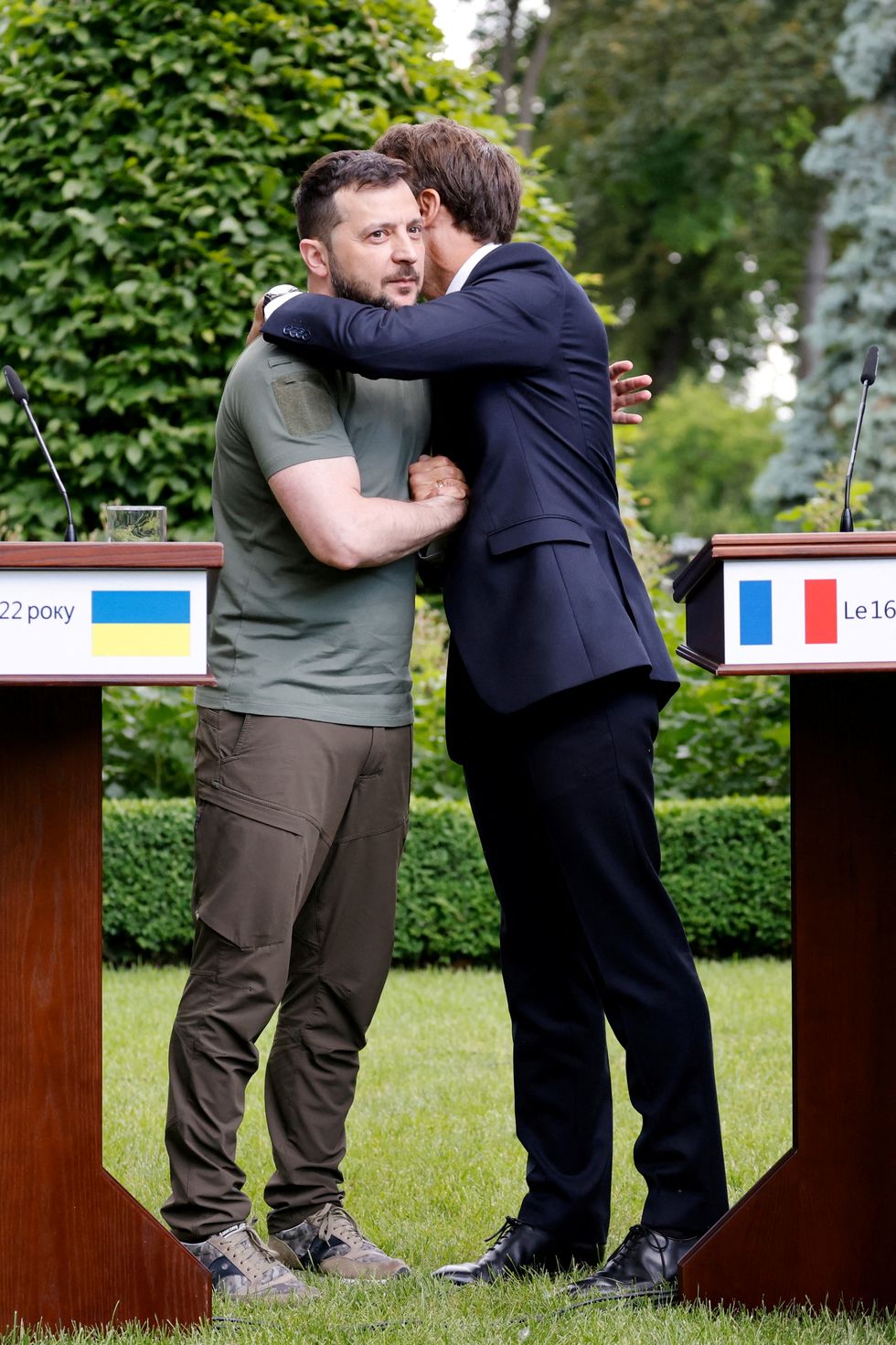 Ukrainian President Volodymyr Zelenskiy and French President Emmanuel Macron embrace after giving a news conference, as Macron, German Chancellor Olaf Scholz and Italian Prime Minister Mario Draghi visit Kyiv, Ukraine June 16, 2022. Ludovic Marin/Pool via REUTERS