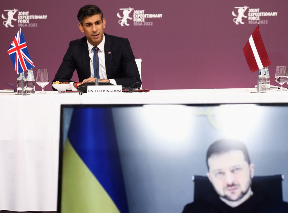 Ukrainian President Volodymyr Zelensky listens via video link as Prime Minister Rishi Sunak speaks during the Joint Expeditionary Force (JEF) Summit in Riga, Latvia. Picture date: Monday December 19, 2022.