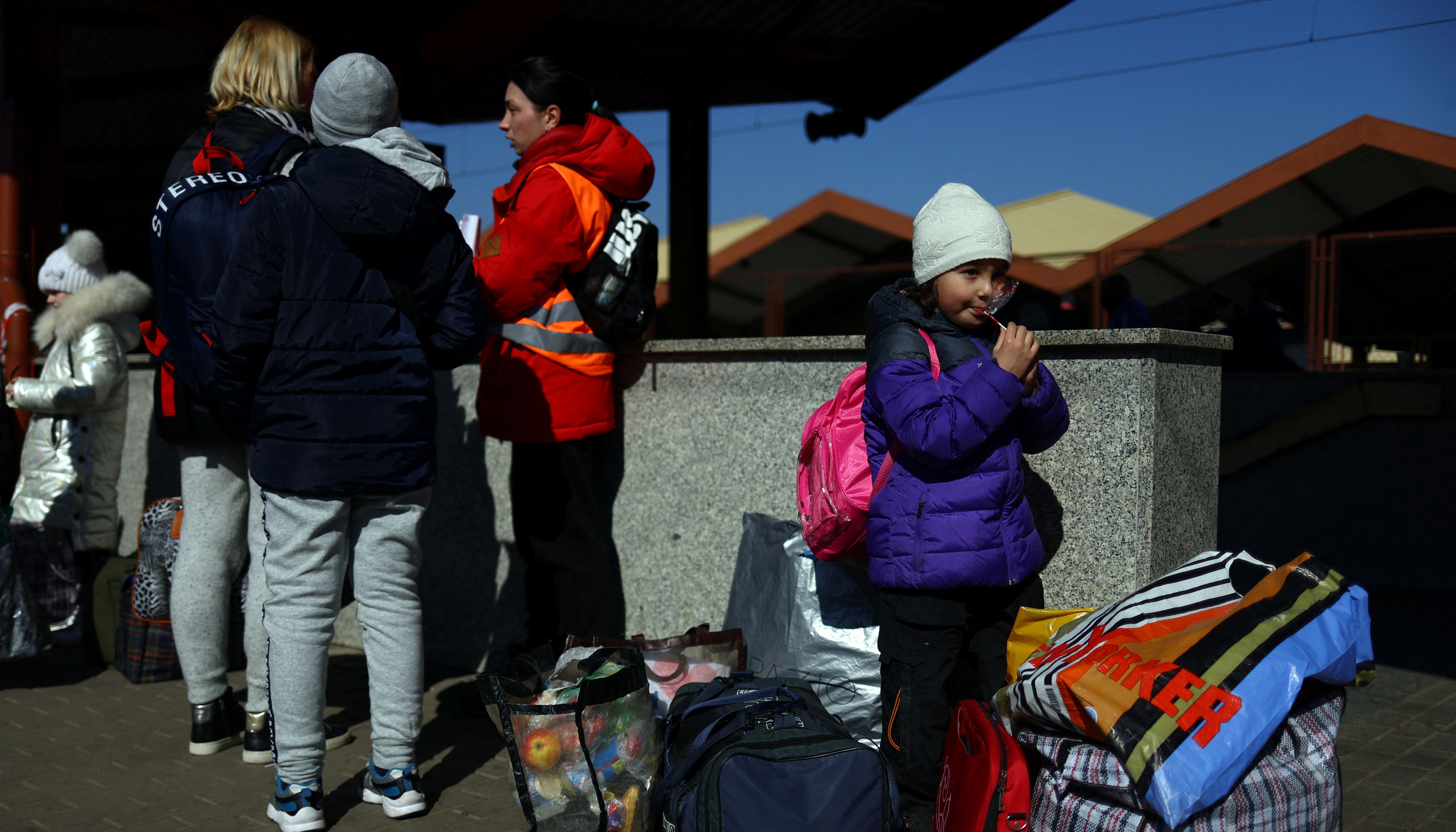 Ukrainian refugees wait on the platform after arriving from Odesa after fleeing the Russian invasion of Ukraine, at Przemysl Glowny train station in Przemysl, Poland, March 21, 2022.REUTERS/Hannah McKay