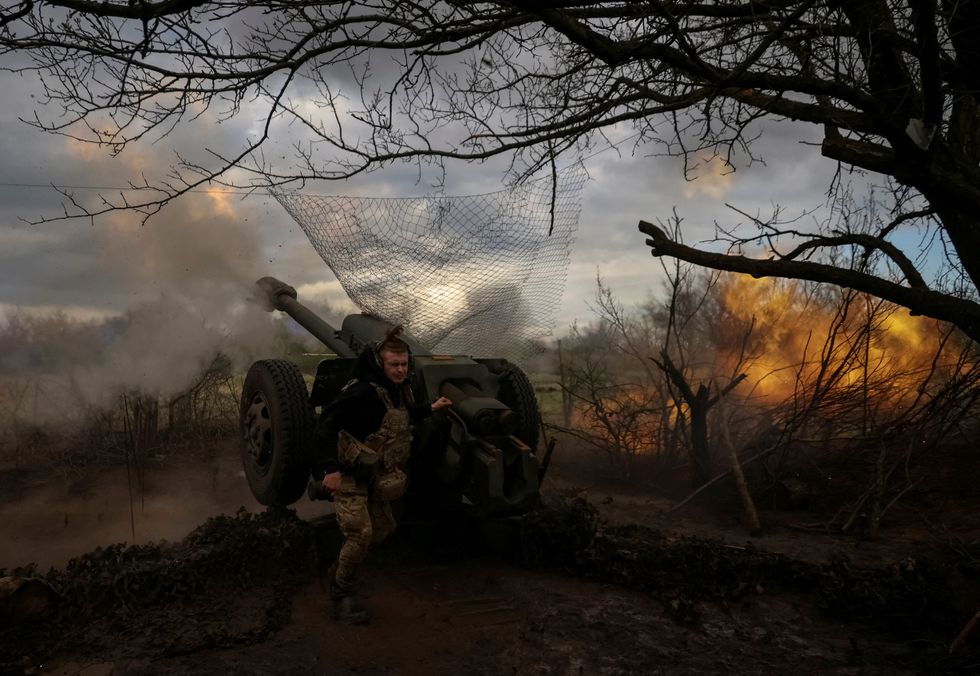 Ukrainian soldier and tank taking fire from Russia