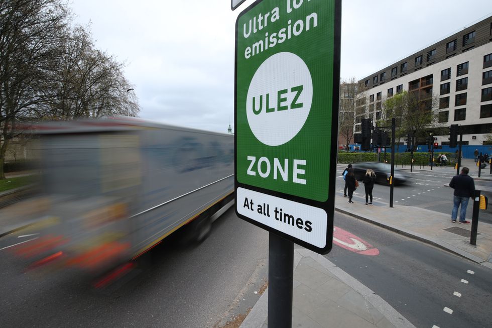 Ulez sign near a busy street in London