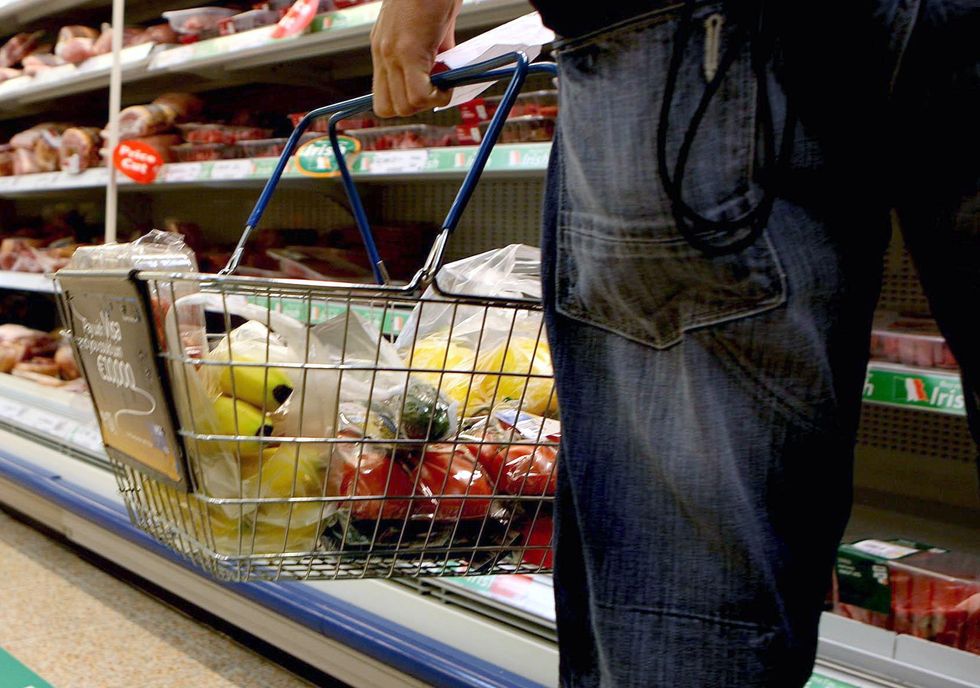Undated file photo of a person holding a shopping basket in a supermarket