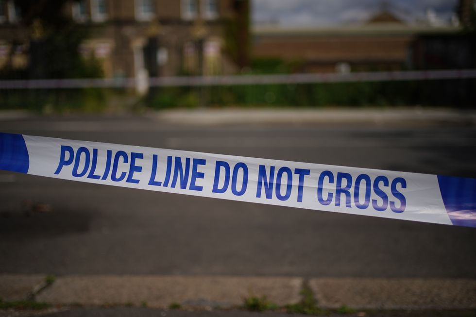 Undated file photo of police tape at a crime scene