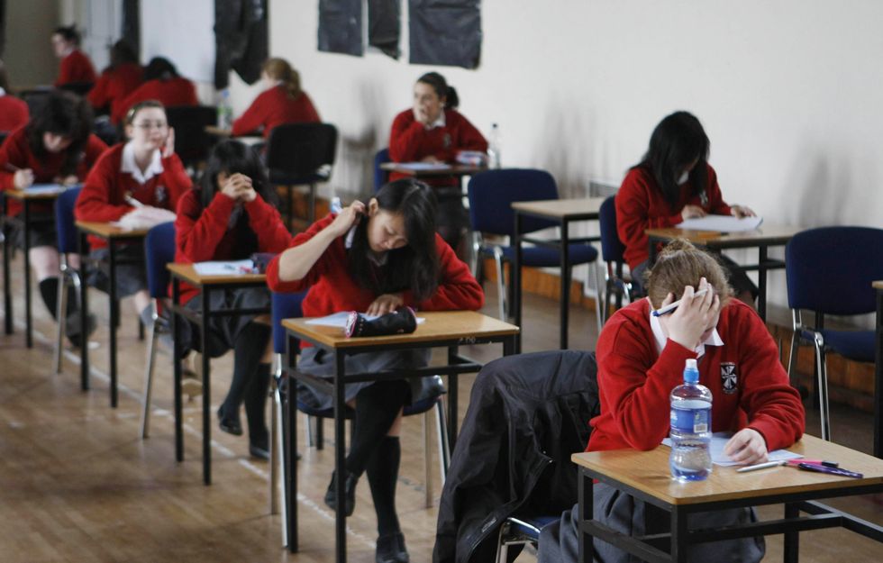 Undated file photo of students sitting an exam. Headteachers have called on the Government to review adaptations to GCSEs and A levels in 2022 in light of the disruption caused by the Omicron variant of Covid-19. And they argue that advance information about the topics covered in papers should be released %22as soon as possible%22. Issue date: Tuesday January 25, 2022.