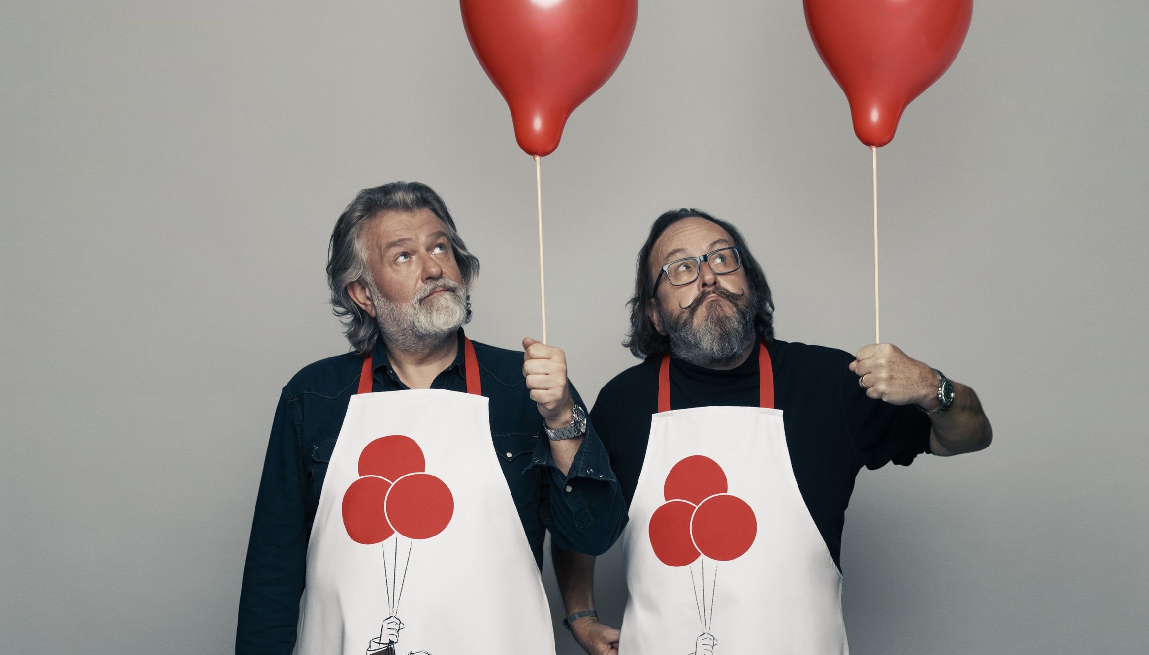 Undated handout photo issued by Comic Relief of Hairy Bikers Si King and Dave Myers supporting Red Nose Day 2021, wearing a themed Comic Relief apron featuring Pixar characters.