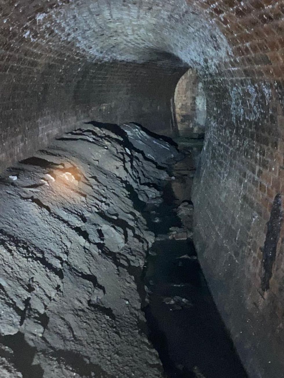 Undated handout photo issued by Thames Water of a fatberg, that had the weight of a small bungalow, under Yabsley Street, Canary Wharf, London, before its removal. Issue date: Friday February 19, 2021.