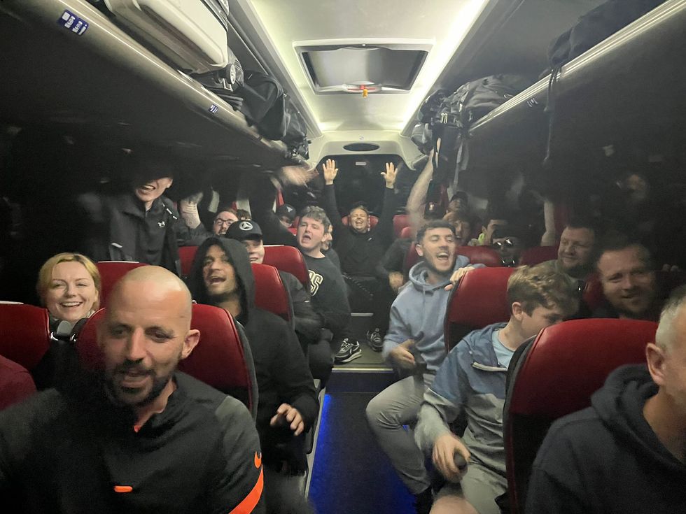 Undated handout photo of Liverpool fans in the coach provided by Simon Wilson with his coach that transported dozens of supporters to Paris for just 1 each ahead of the Champions League final. The Reds will take on 13-time winners Real Madrid at the Stade de France on Saturday, with many fans facing huge fees to get to the city. Issue date: Saturday May 28, 2022.