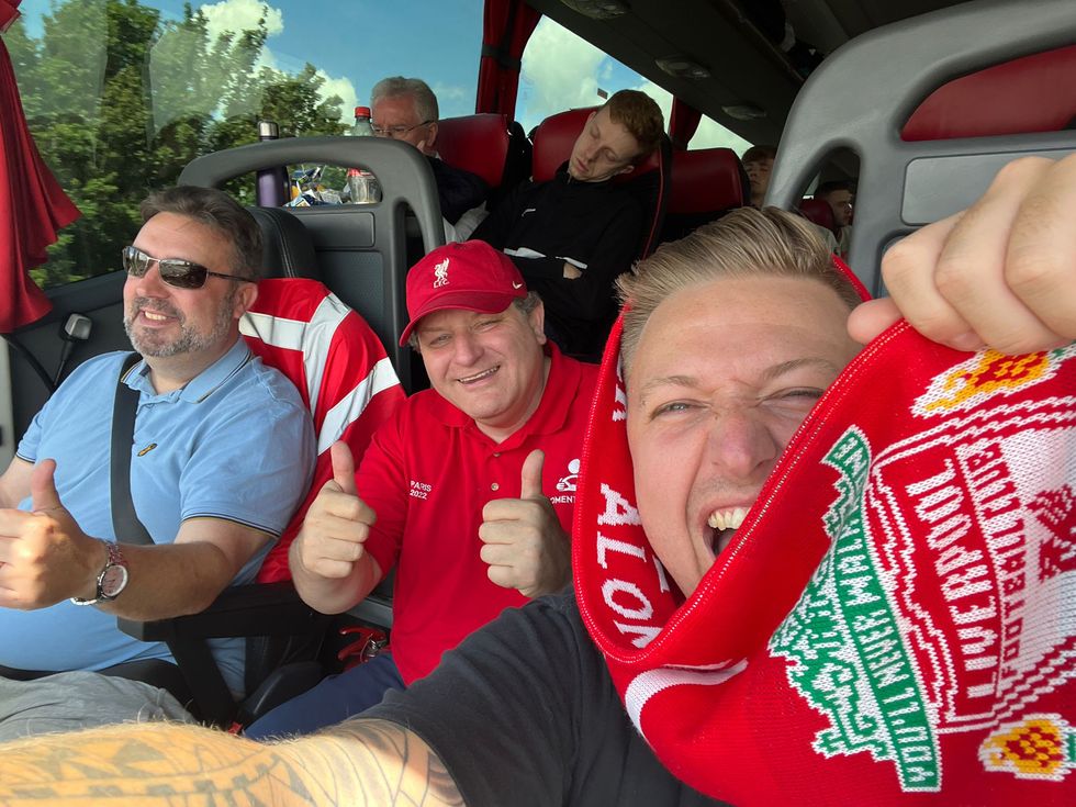 Undated handout photo of Liverpool supporter Simon Wilson (right) with his coach that transported dozens of fellow fans to Paris for just 1 each ahead of the Champions League final. The Reds will take on 13-time winners Real Madrid at the Stade de France on Saturday, with many fans facing huge fees to get to the city. Issue date: Saturday May 28, 2022.