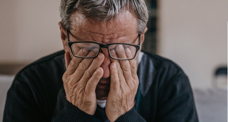 Unhappy man and DWP sign