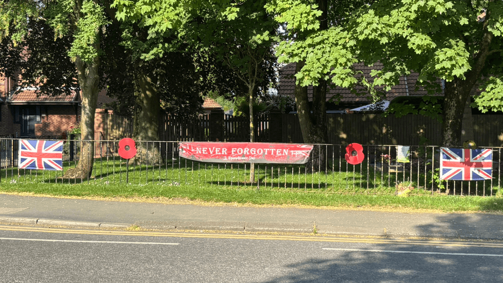 Union flag and poppy signage