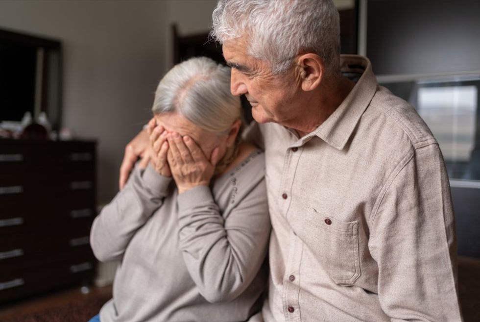 UPSET ELDERLY COUPLE