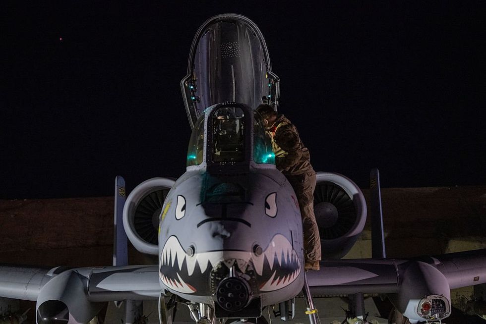US airman preparing an A-10 Thunderbolt for a mission