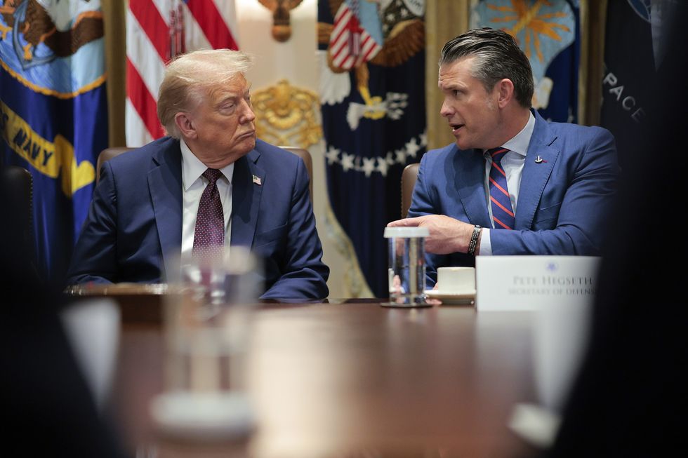 US Defense Secretary Pete Hegseth speaks alongside President Donald Trump