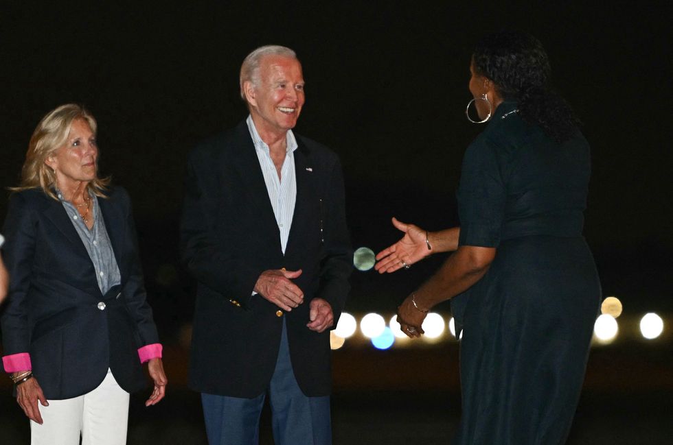 US President Joe Biden and First Lady Jill Biden greet Congresswoman Stacey Plaskett before boarding Air Force One ahead of departing Henry E. Rohlsen Airport