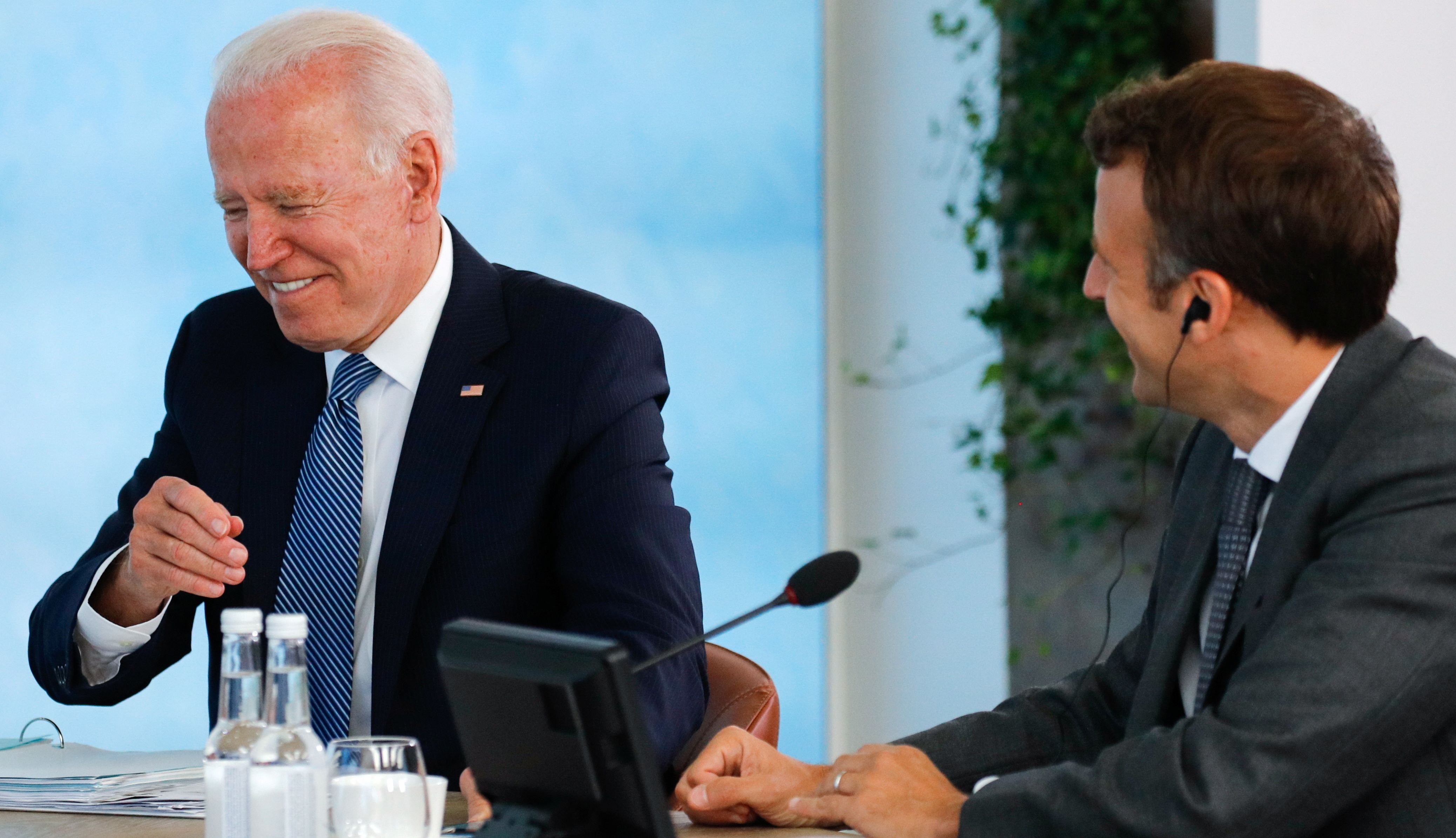 US President Joe Biden and French President Emmanuel Macron attend a plenary session, during the G7 summit.
