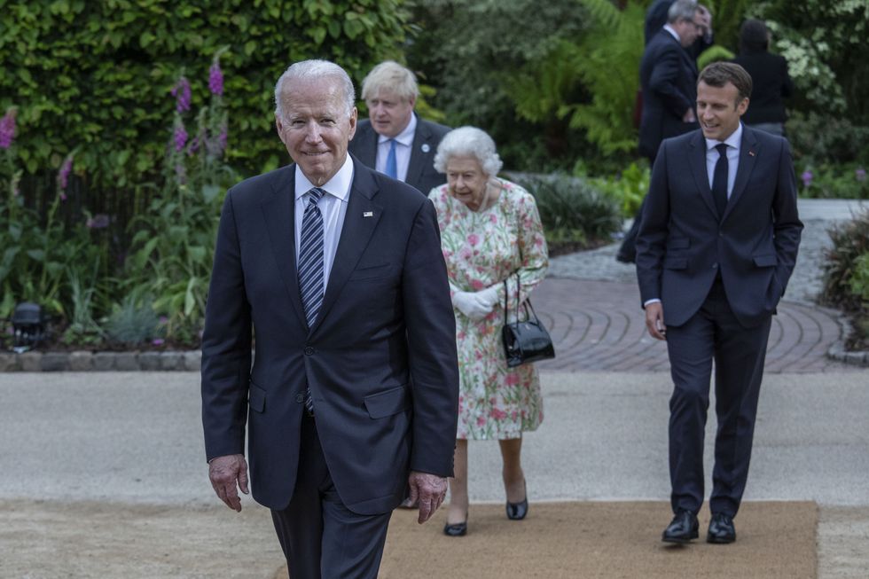 US President Joe Biden makes his way for a group photo before a reception at the Eden Project.