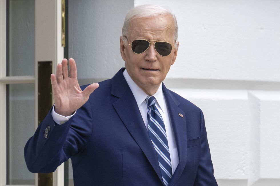 US President Joe Biden waves as he walks to Marine One