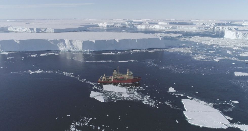 US research ship RV Nathaniel B Palmer, seen next to fields of giant icebergs