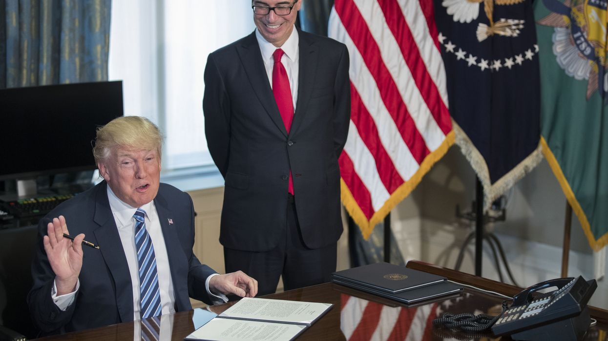 US Treasury Secretary Steven Mnuchin smiles with donald trump in the oval office