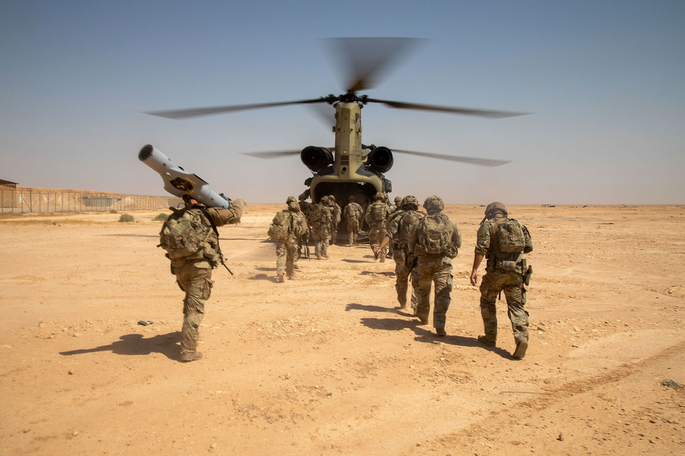 US troops board a Chinook helicopter after a live-fire exercise in Iraq