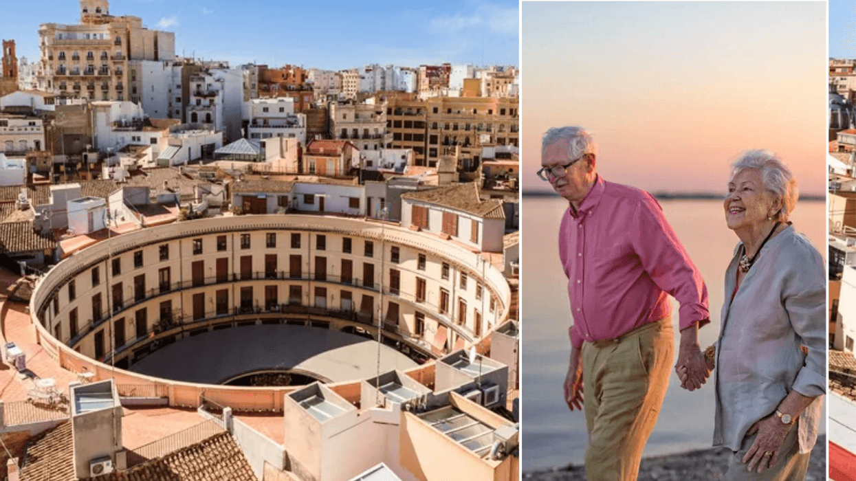 Valencia, Spain / Older couple walking on beach
