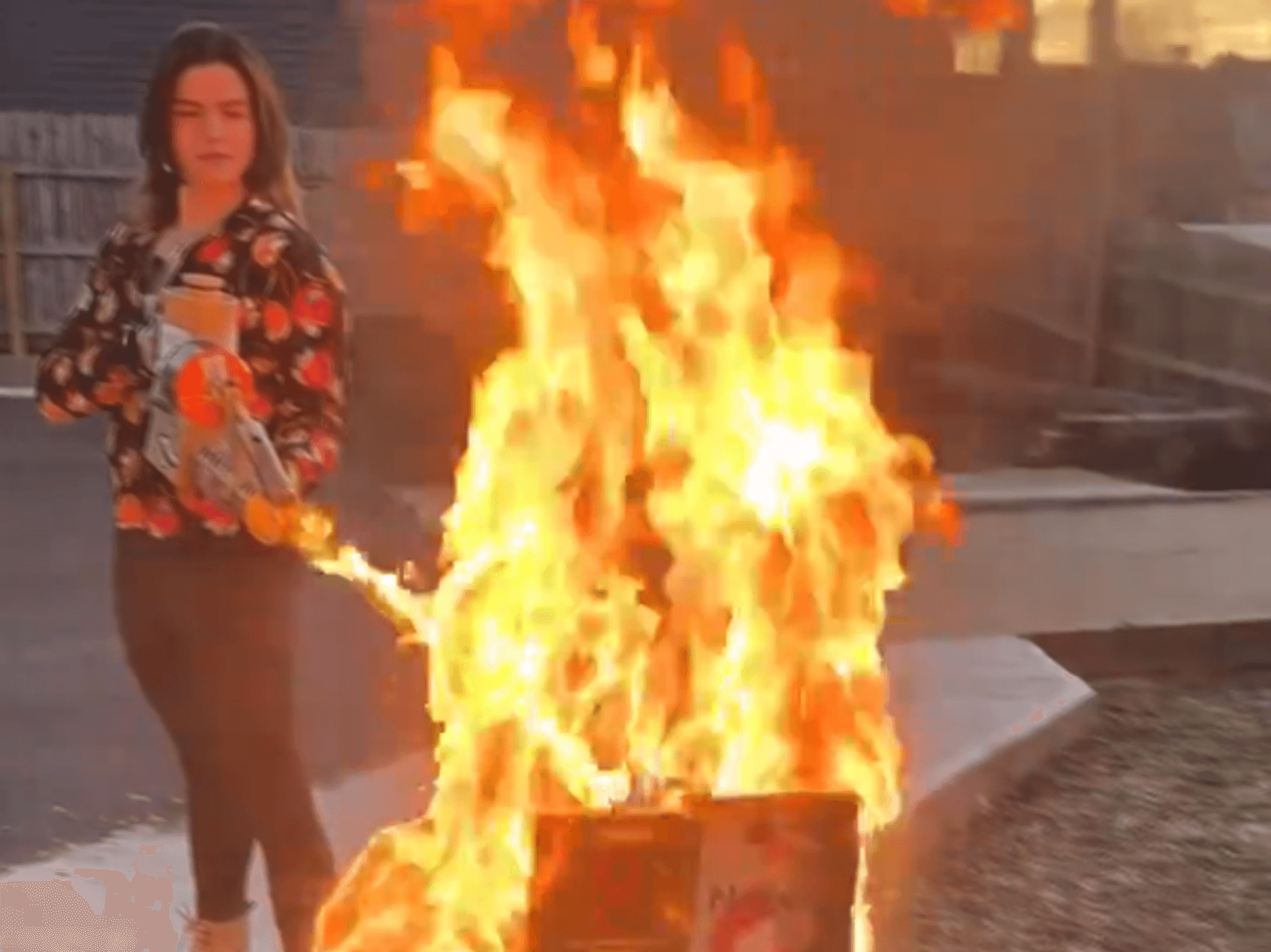 Valentina Gomez burning books