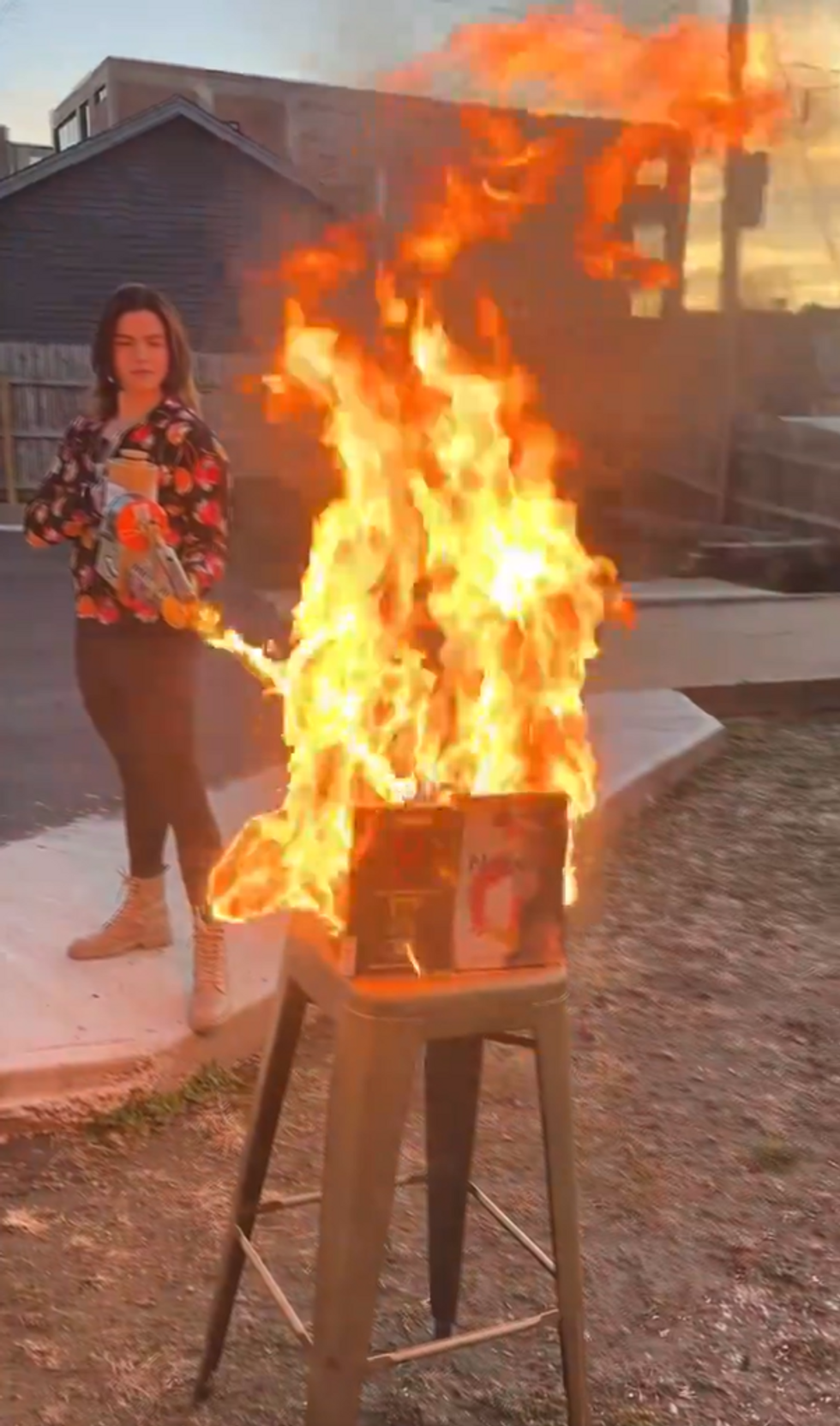 Valentina Gomez burning books