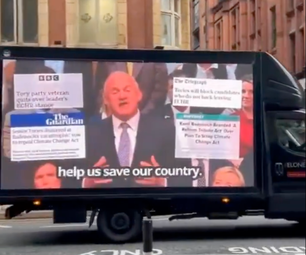 Van showing clip of Ed Davey speaking in Manchester