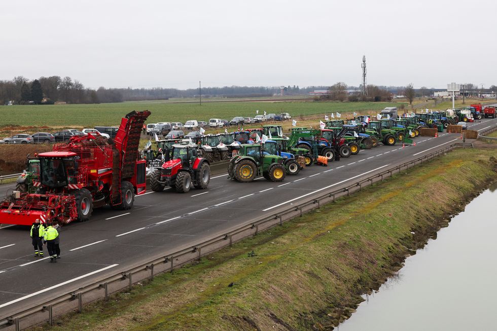 Vehicles are lined up during a blockade by farmers on the A4 highway