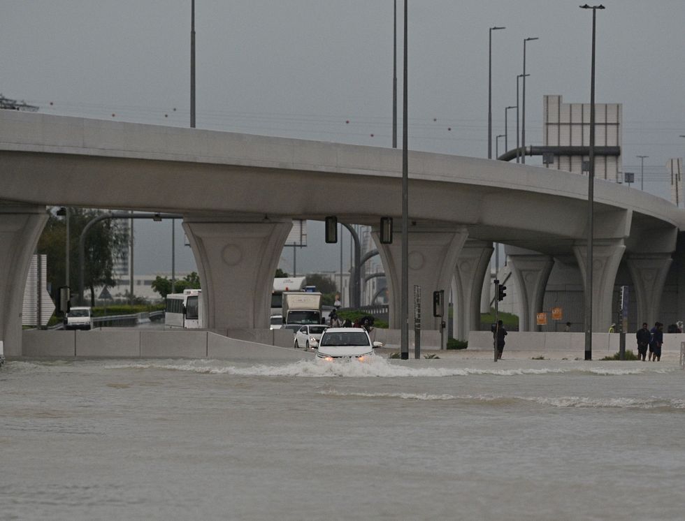 Vehicles hardly move on flooded streets due to heavy rain in Dubai,