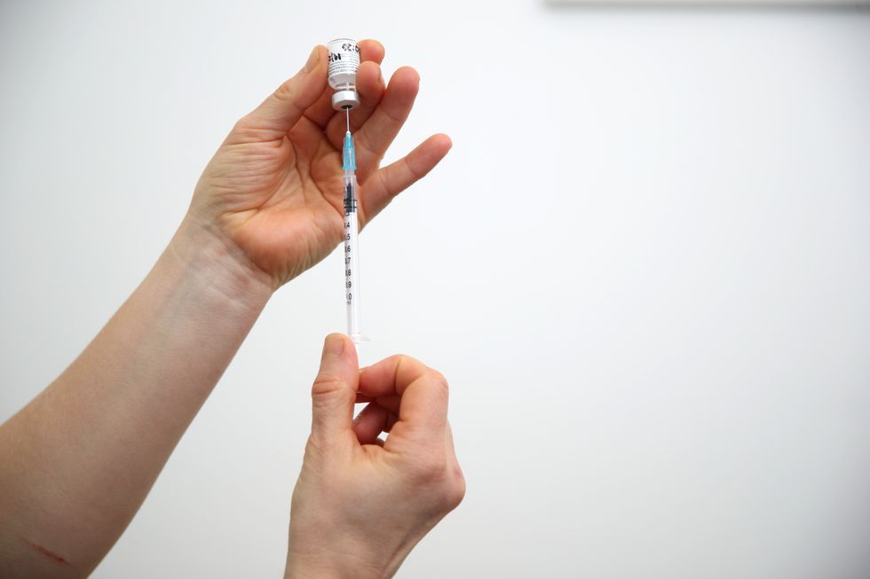Vial of the Pfizer-BioNTech coronavirus vaccine prepared for injection.