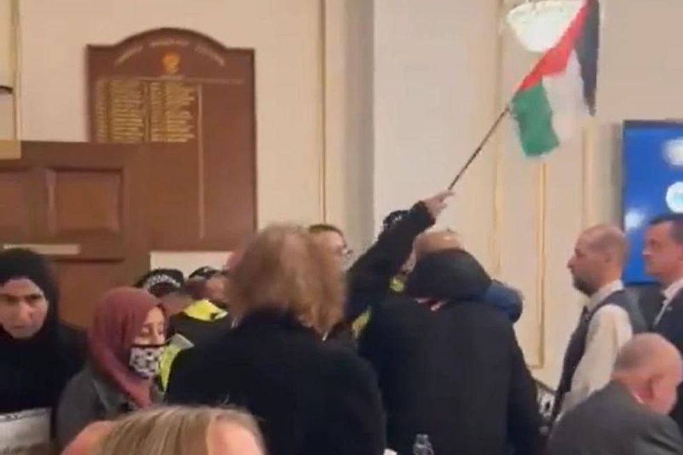 Video footage from the meeting in Chorley showed events take a turn after a Tory Councillor attempted to restore order