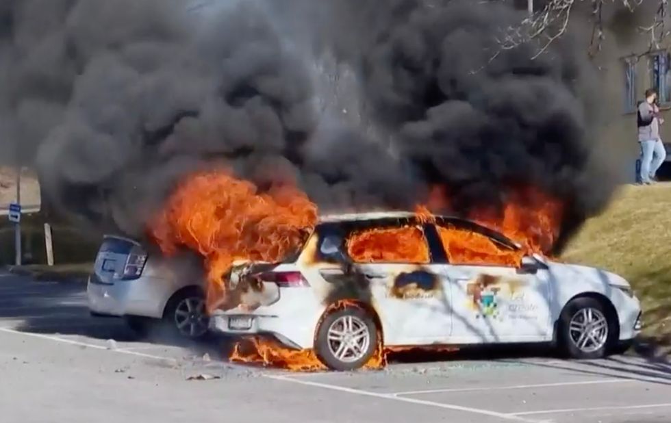 Video footage shows a car set ablaze during the violent riots that have erupted across Sweden