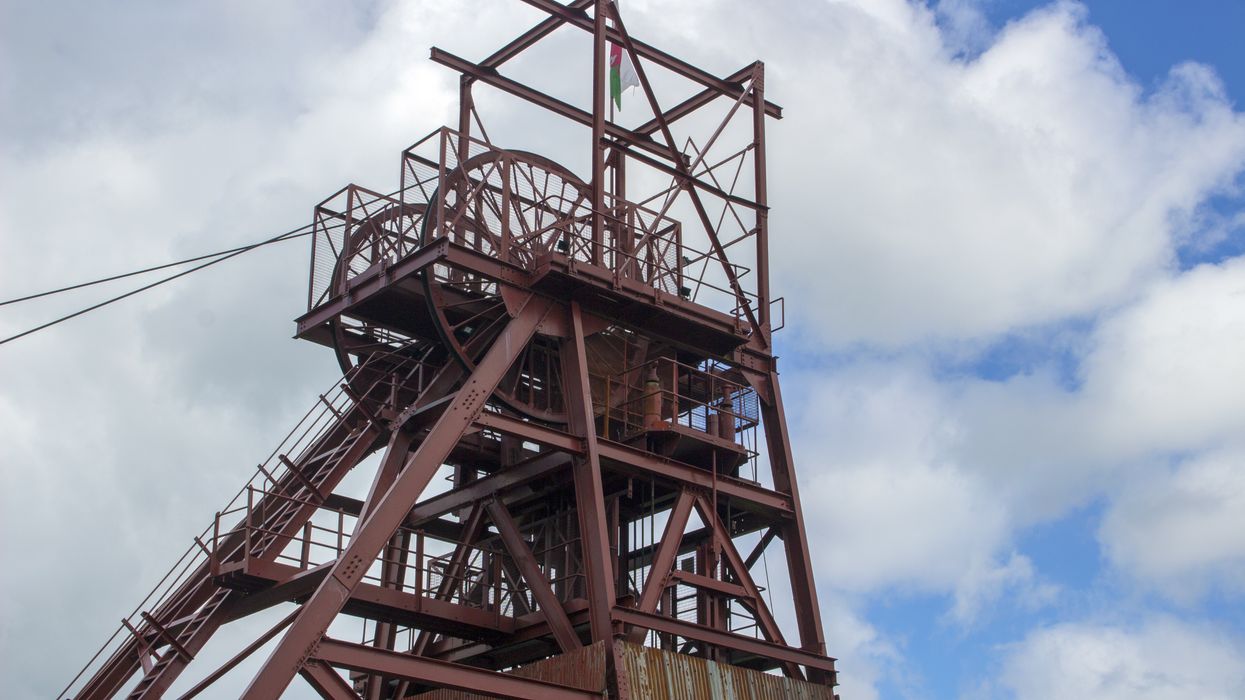 View of the winding tower powering the lift in the shaft leading down to the former Big Pit coal mine at the Big Pit National Coal Museum