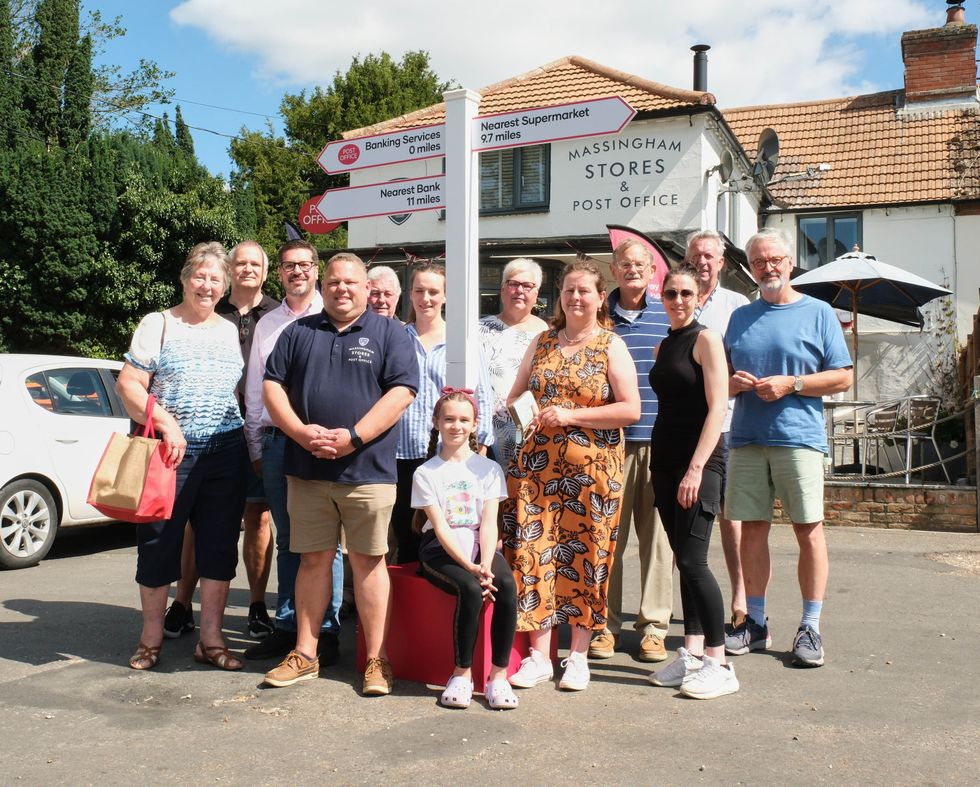 Villagers outside the Post Office
