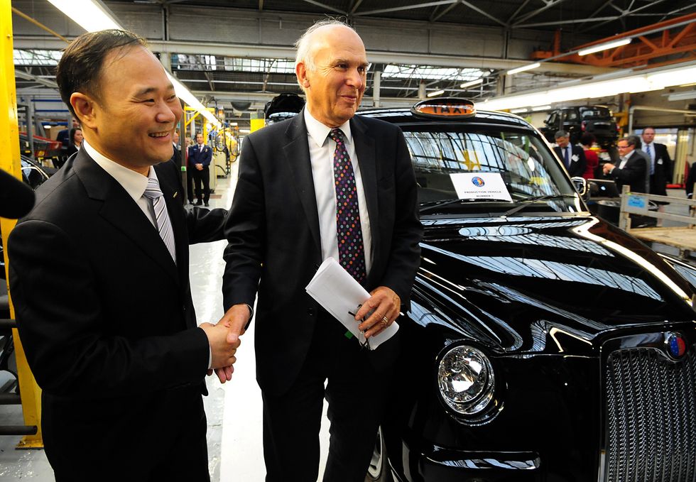 Vince Cable with Li Shufu, Chairman of Geely Automobile Holdings during a visit to The London Taxi Company, Coventry, following its successful acquisition by Geely Automobile Holding
