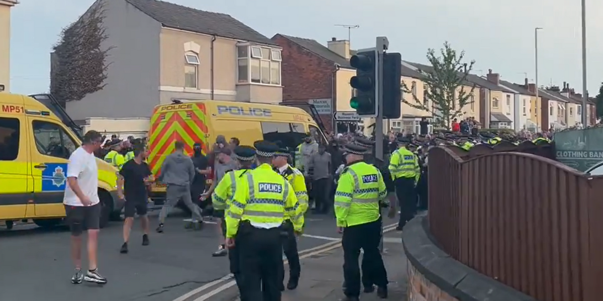 NextImg:Police officers 'suffer minor injuries' in clashes outside mosque in Southport as protesters chant 'no surrender' and 'English till I die'