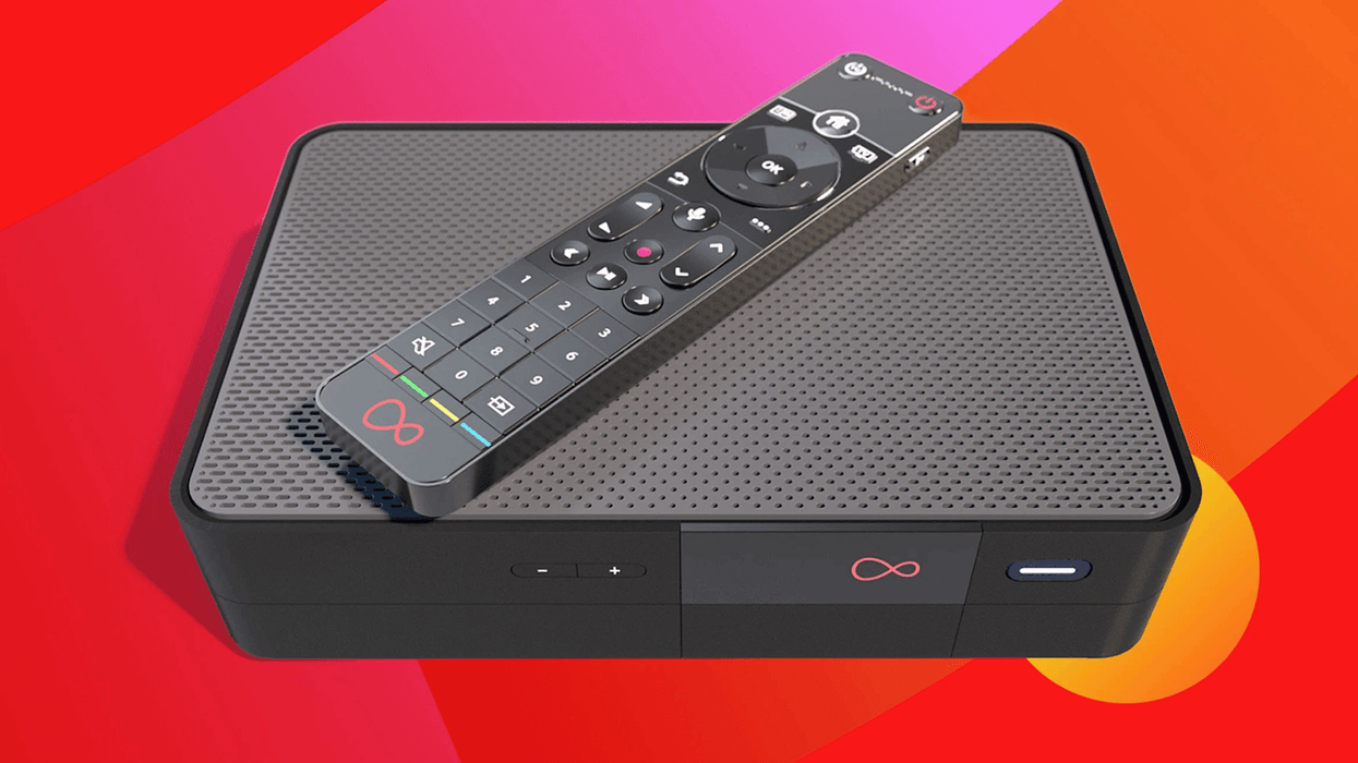 virgin media tv 360 box with a remote control lying on-top with a colourful swirling background