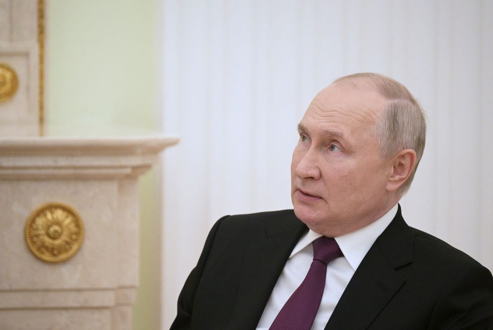 Vladimir Putin attends a meeting with South Sudan's President Salva Kiir at the Kremlin in Moscow