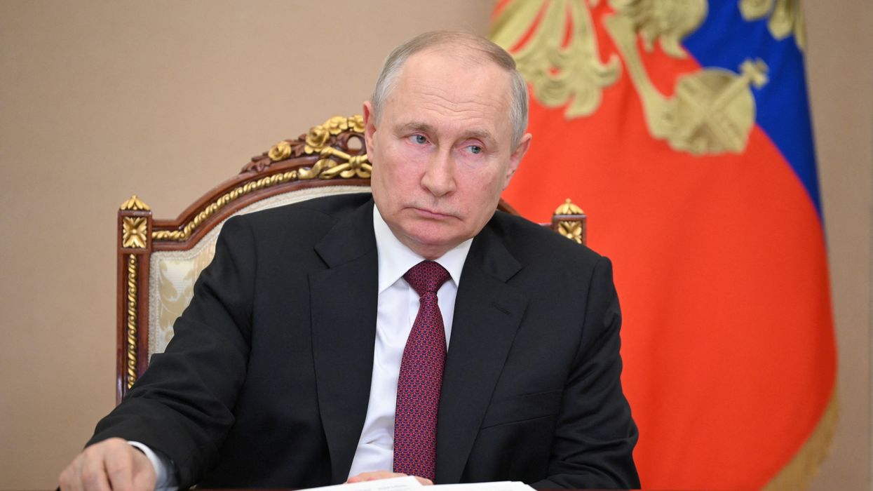 Vladimir Putin chairing a meeting in Moscow
