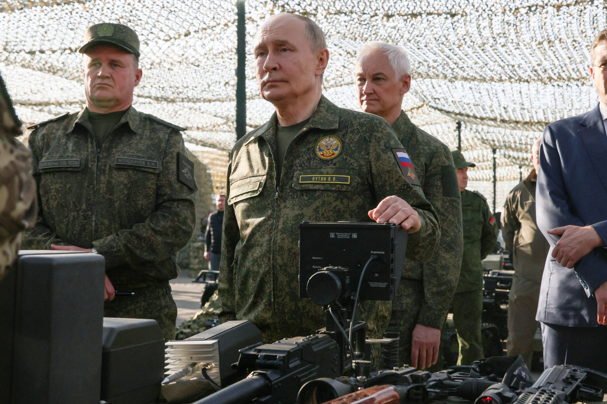 Vladimir Putin inspecting military equipment