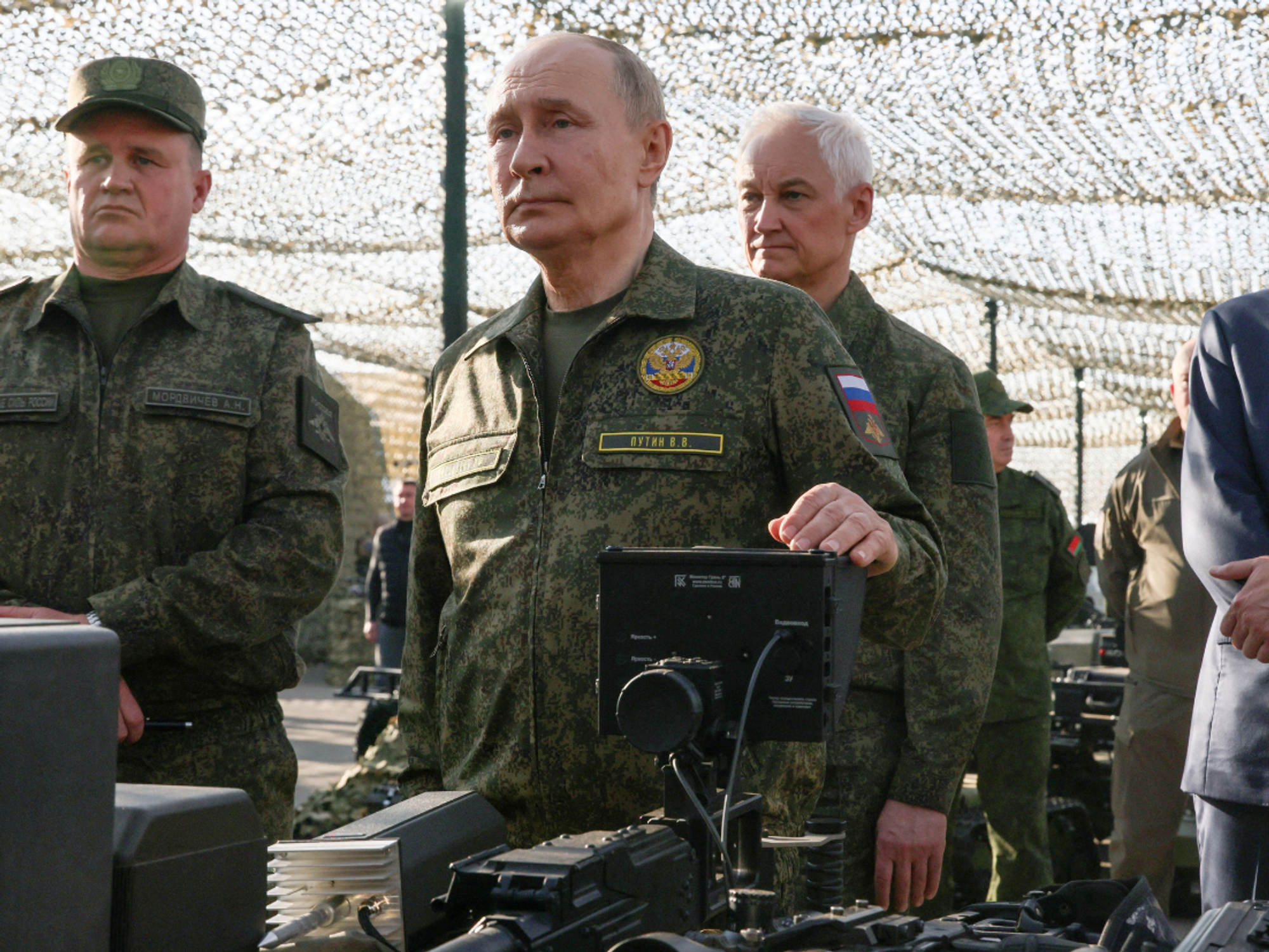 Vladimir Putin inspecting military equipment
