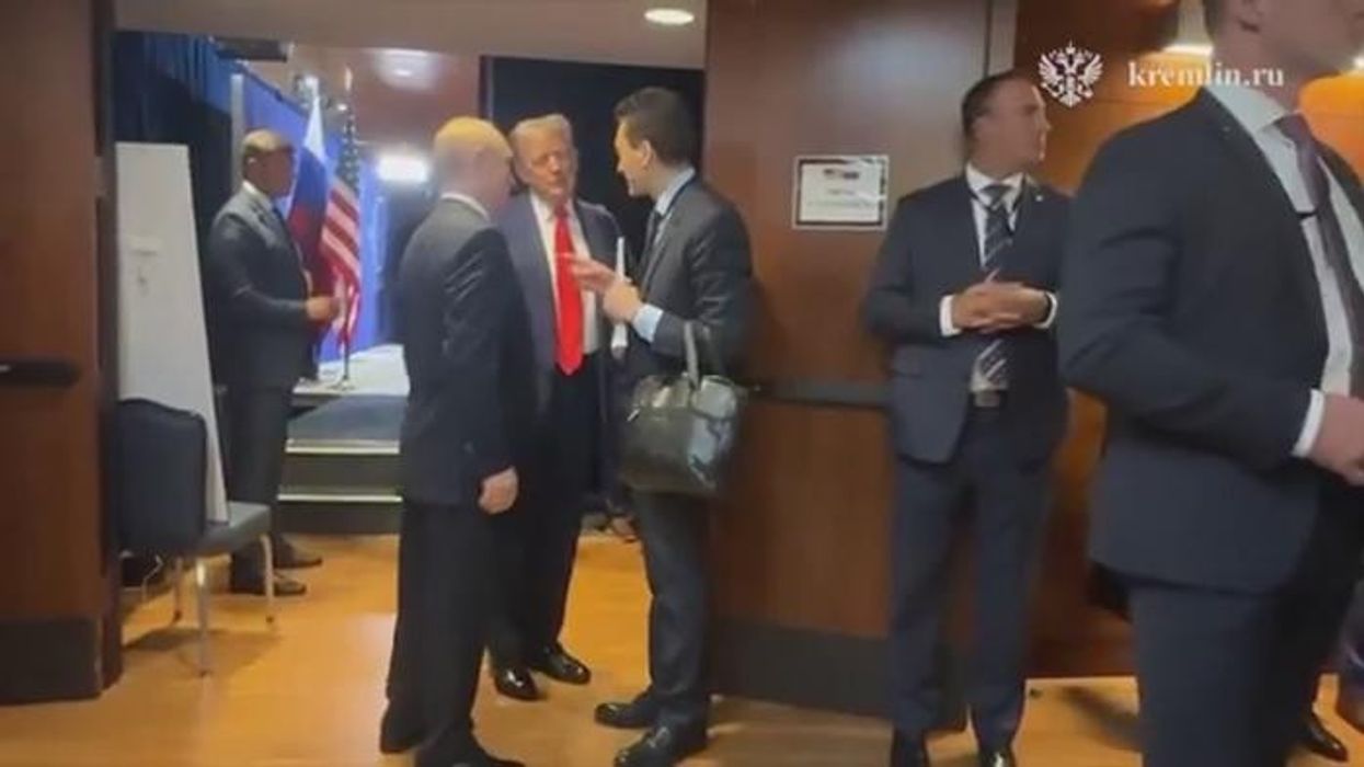 Baffling moment Vladimir Putin's legs 'twitch uncontrollably' during Donald Trump talks