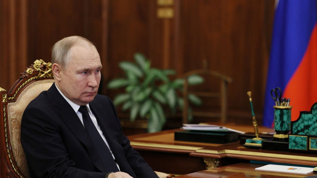 Vladimir Putin sat in the Kremlin