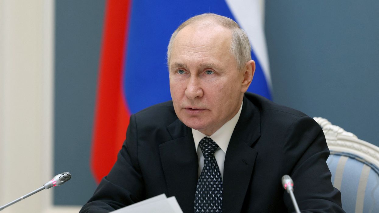 Vladimir Putin with pieces of paper